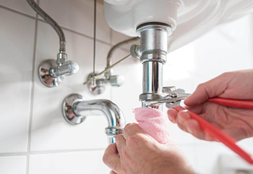 Tighten the connection if sink trap leaking