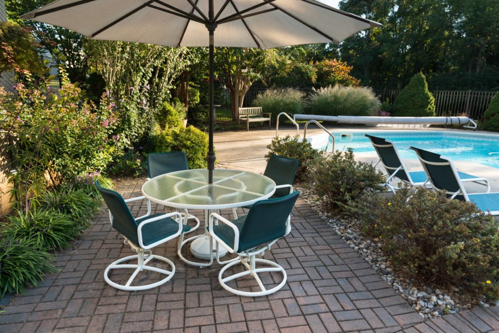 Remove the patio furniture so you can clean the pavers.