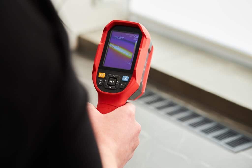 professional using infrared camera technology in a home inspection