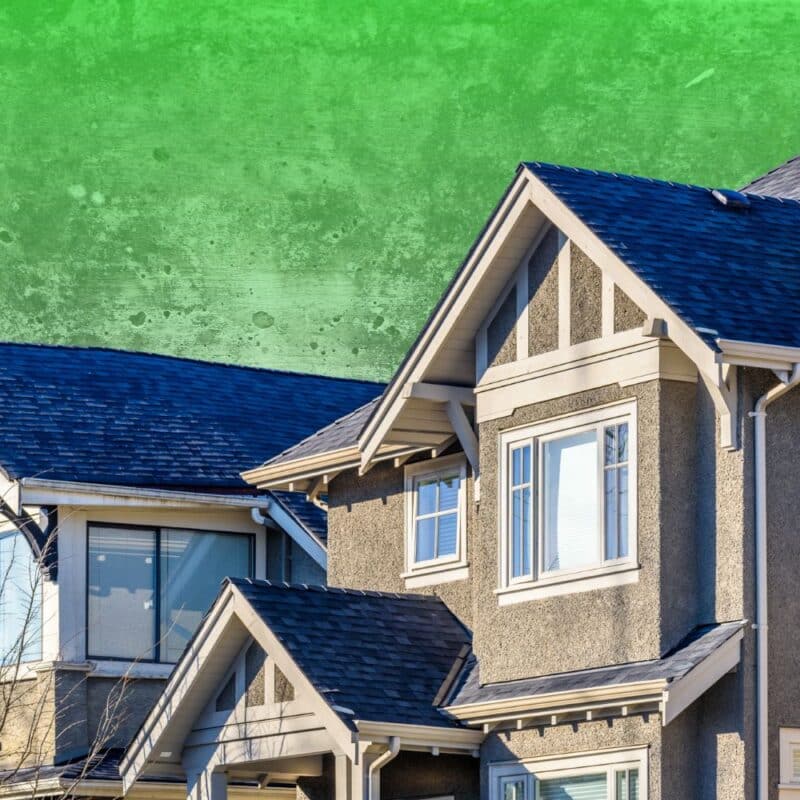 Exterior view of a multi-story modern stucco home set against a textured, mottled bright green background.